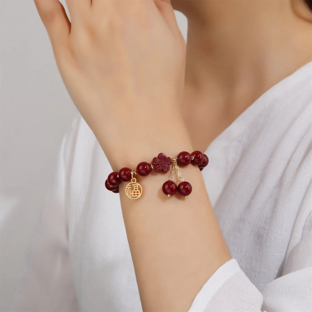 Women's cinnabar bracelet with fu character design and tassel in national style
