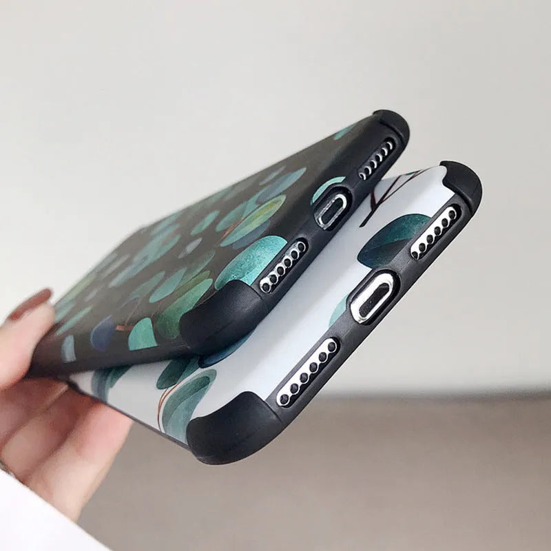 Black silicone iPhone case with a raised leaf pattern design on the back.