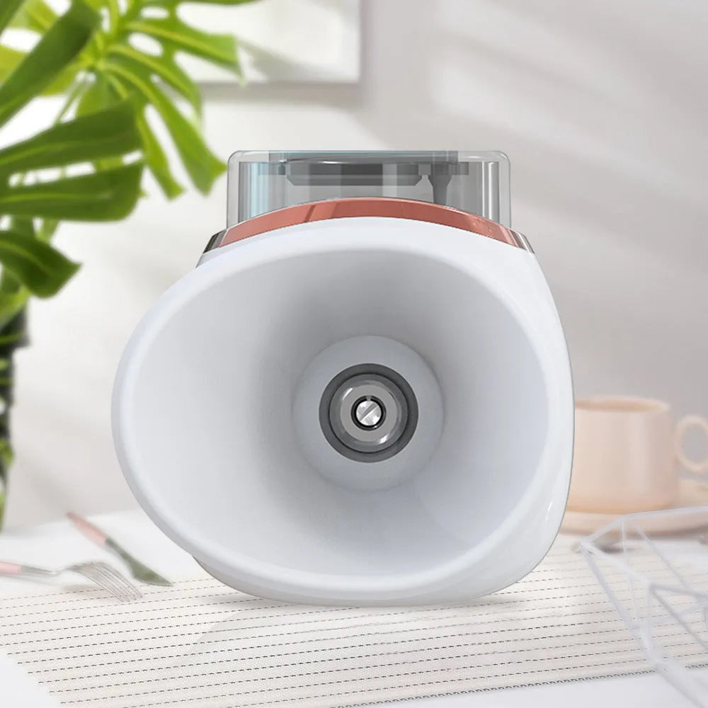 White and purple household eye humidifier with charging cable on desktop