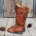 Women's black chunky heel high-leg ankle boots with a round toe on a plain background.