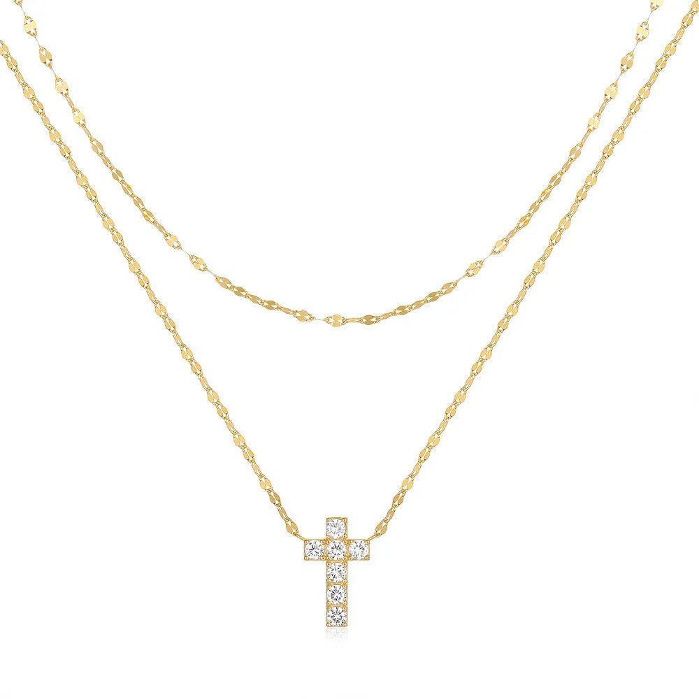 Sterling silver geometric cross pendant necklace with double layer design and diamond detailing on clavicle chain
