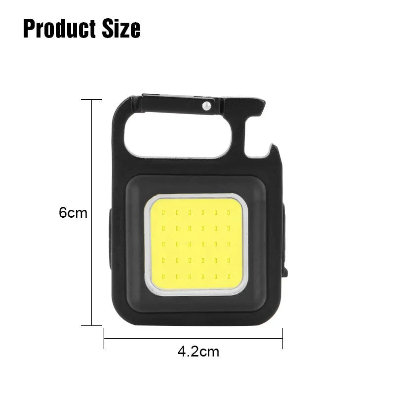 Black aluminium alloy USB rechargeable keychain light with LED, magnet, and folding handle