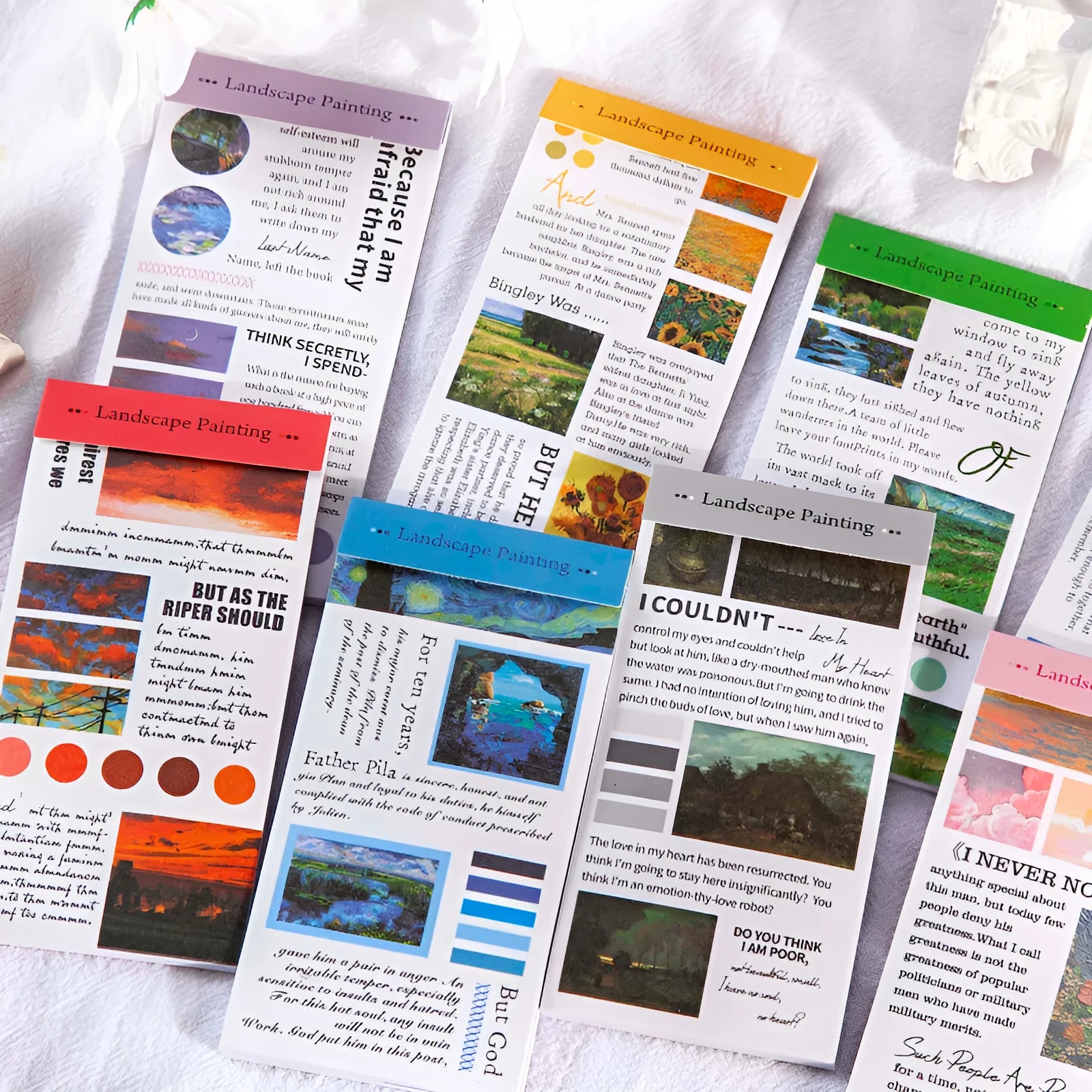 Paper stickers with landscape paintings measuring 60 by 120 millimetres