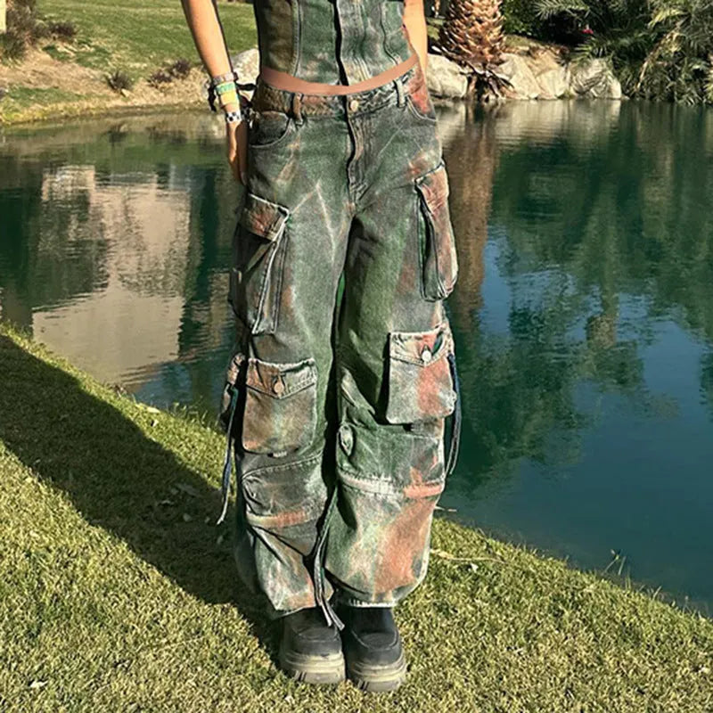 Loose-fit blue denim cargo trousers with multiple front pockets showing gradient colour details