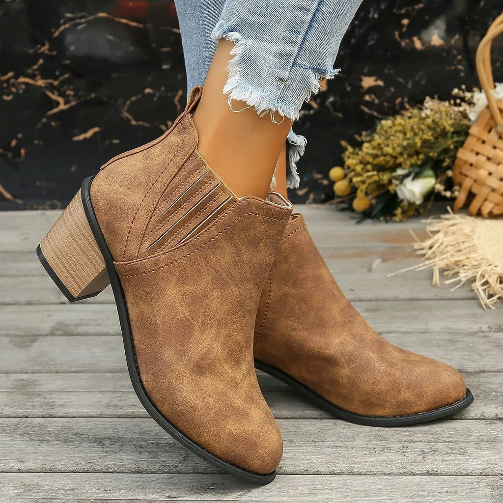 Women's black ankle boots with pointed toe and thick square heel, slip-on design for autumn winter wear
