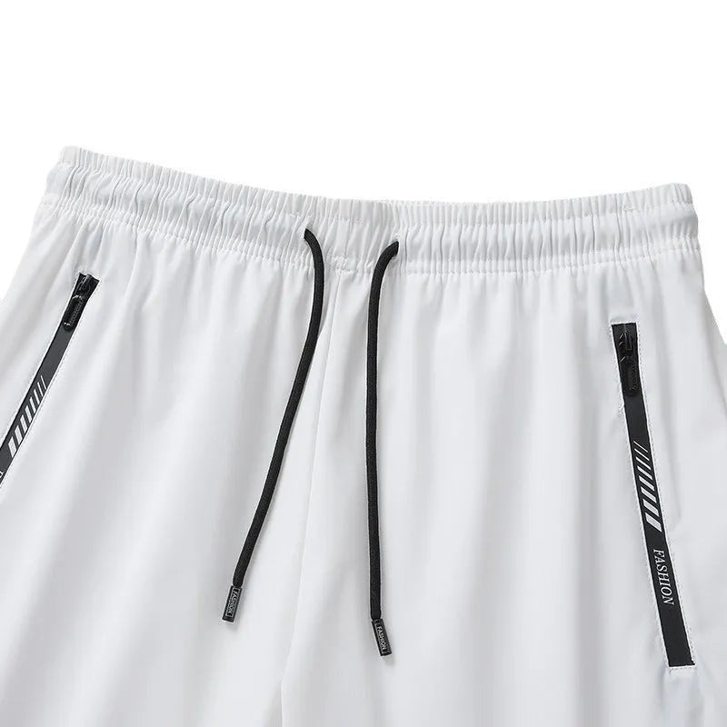 Man wearing black loose-fit quick-dry nylon sports shorts for summer activities