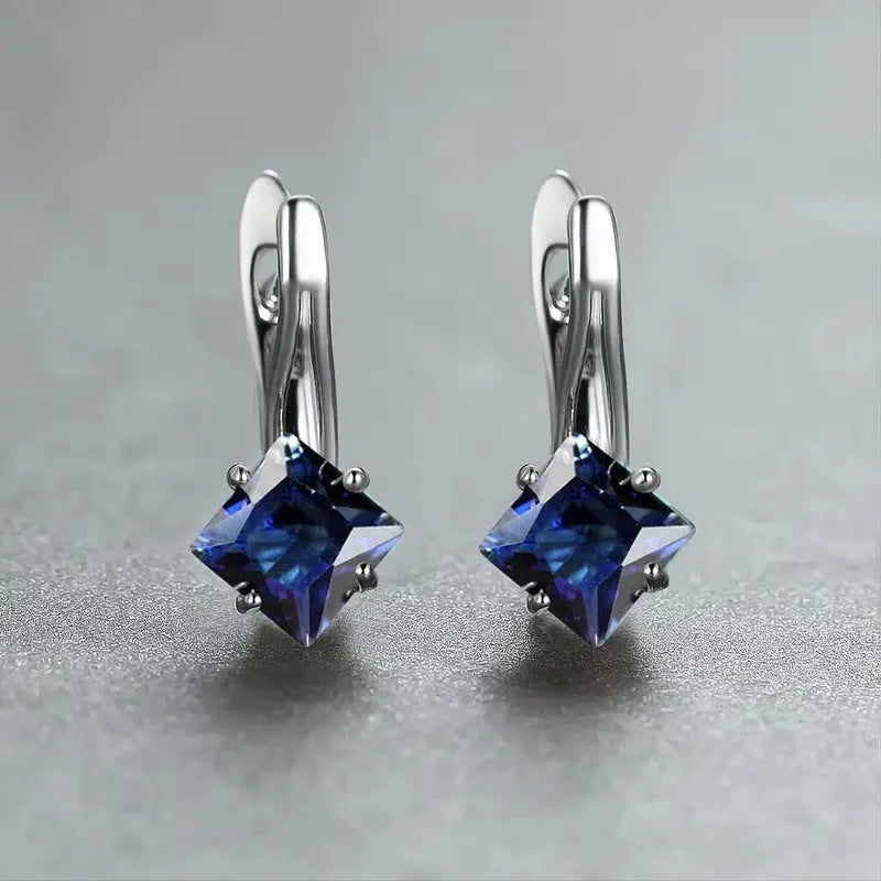 Copper diamond-shaped earrings for women with inlaid zircon stones in blue, green, and colour variants.