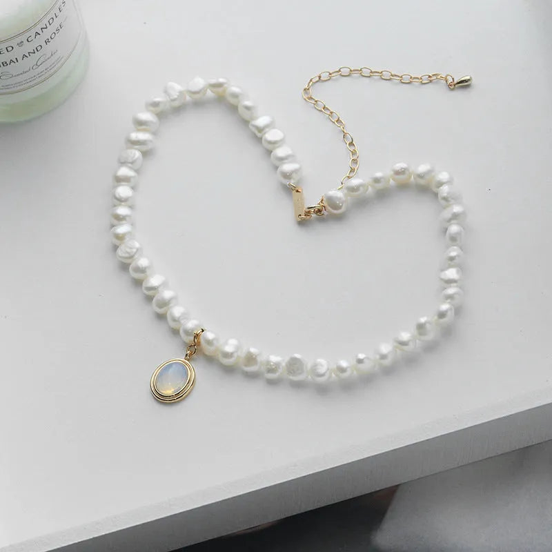 925 sterling silver necklace with geometric round medal pearl pendant on an adjustable chain.