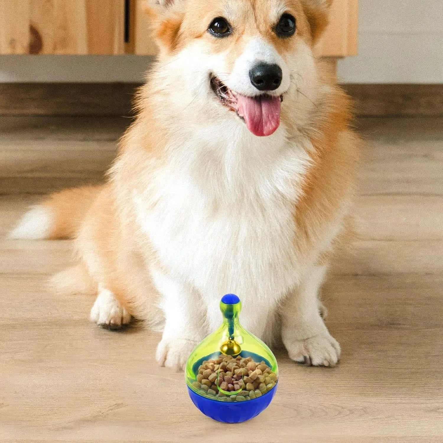 Interactive pet treat dispenser tumble ball toy measuring 14x10x10cm for dogs and cats