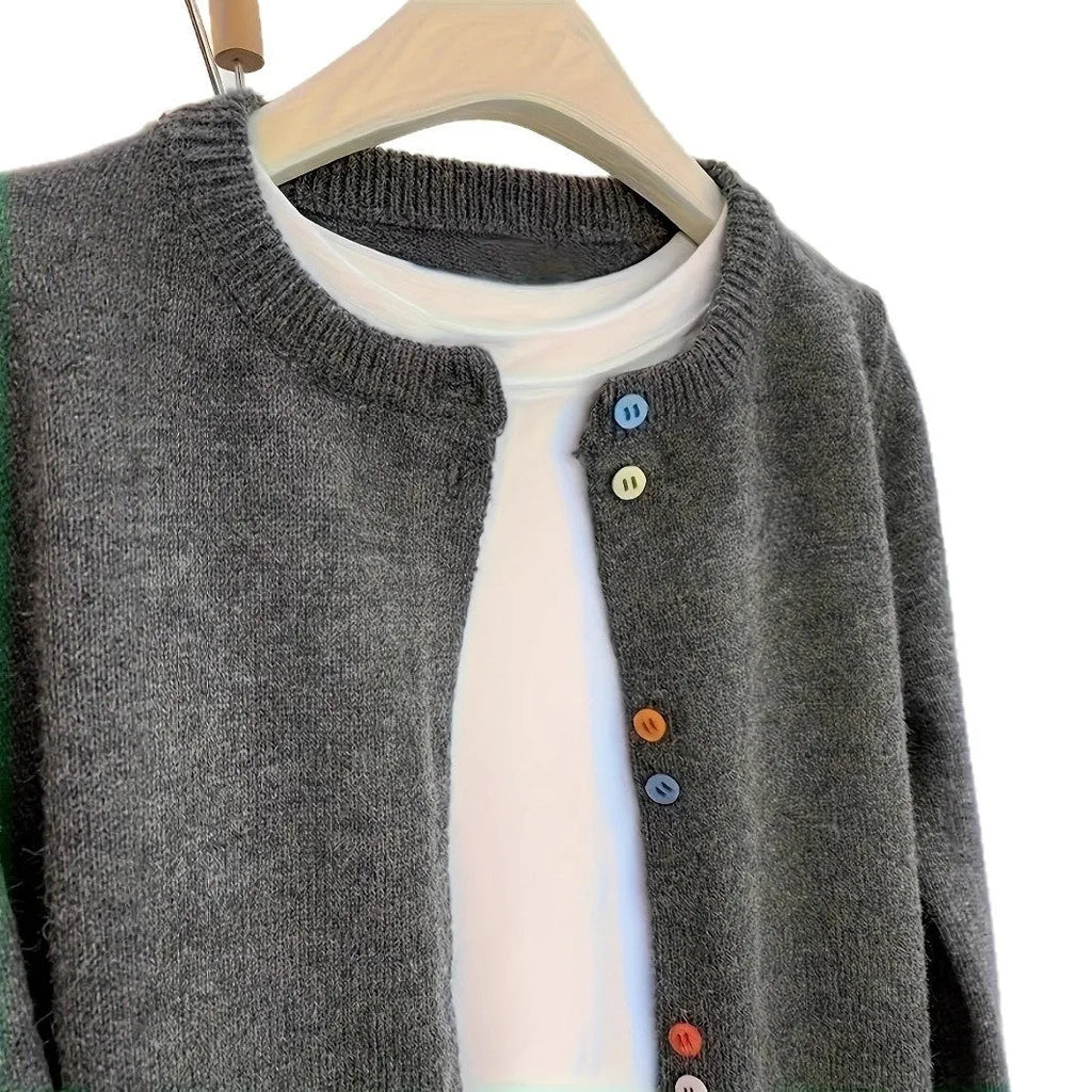 Dark grey women's button-front cardigan sweater with long sleeves on a hanger.