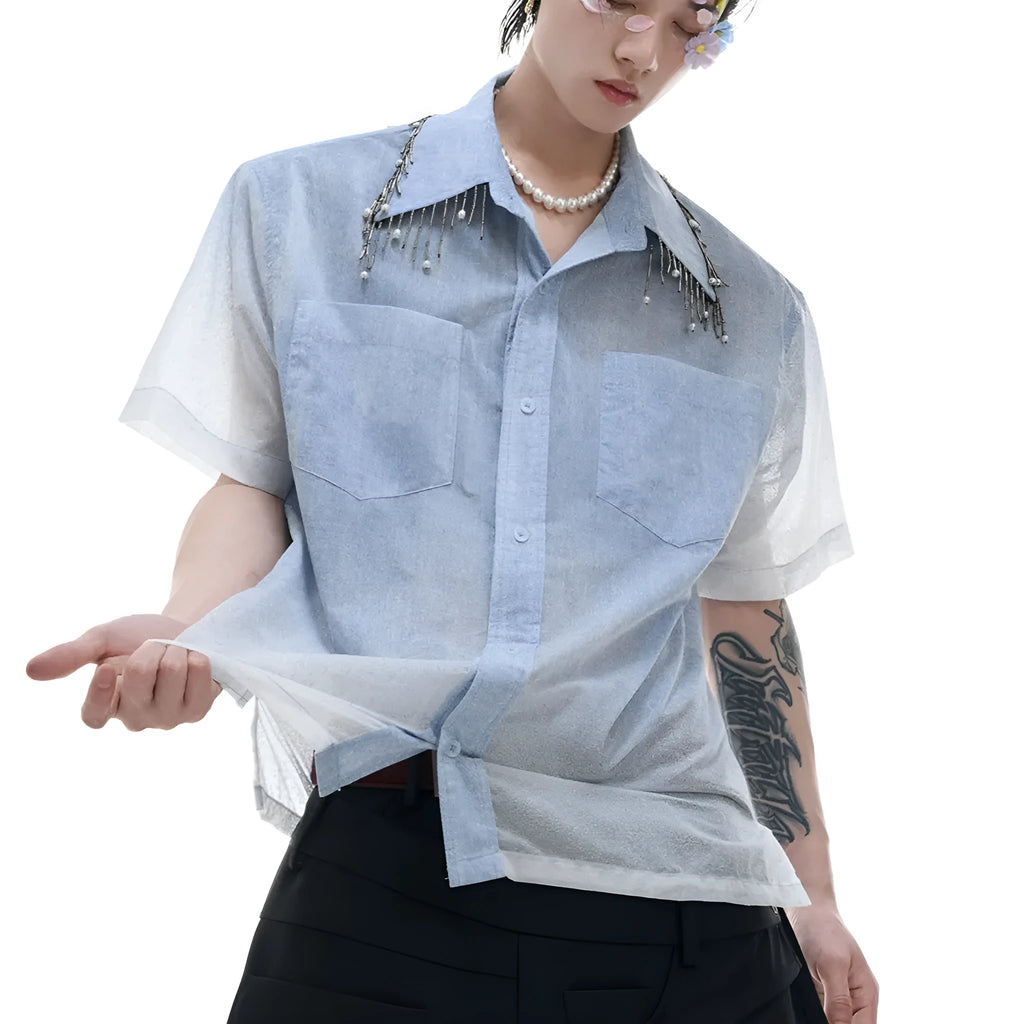 Man wearing a loose fit blue and white gradient short sleeve shirt with quilted details
