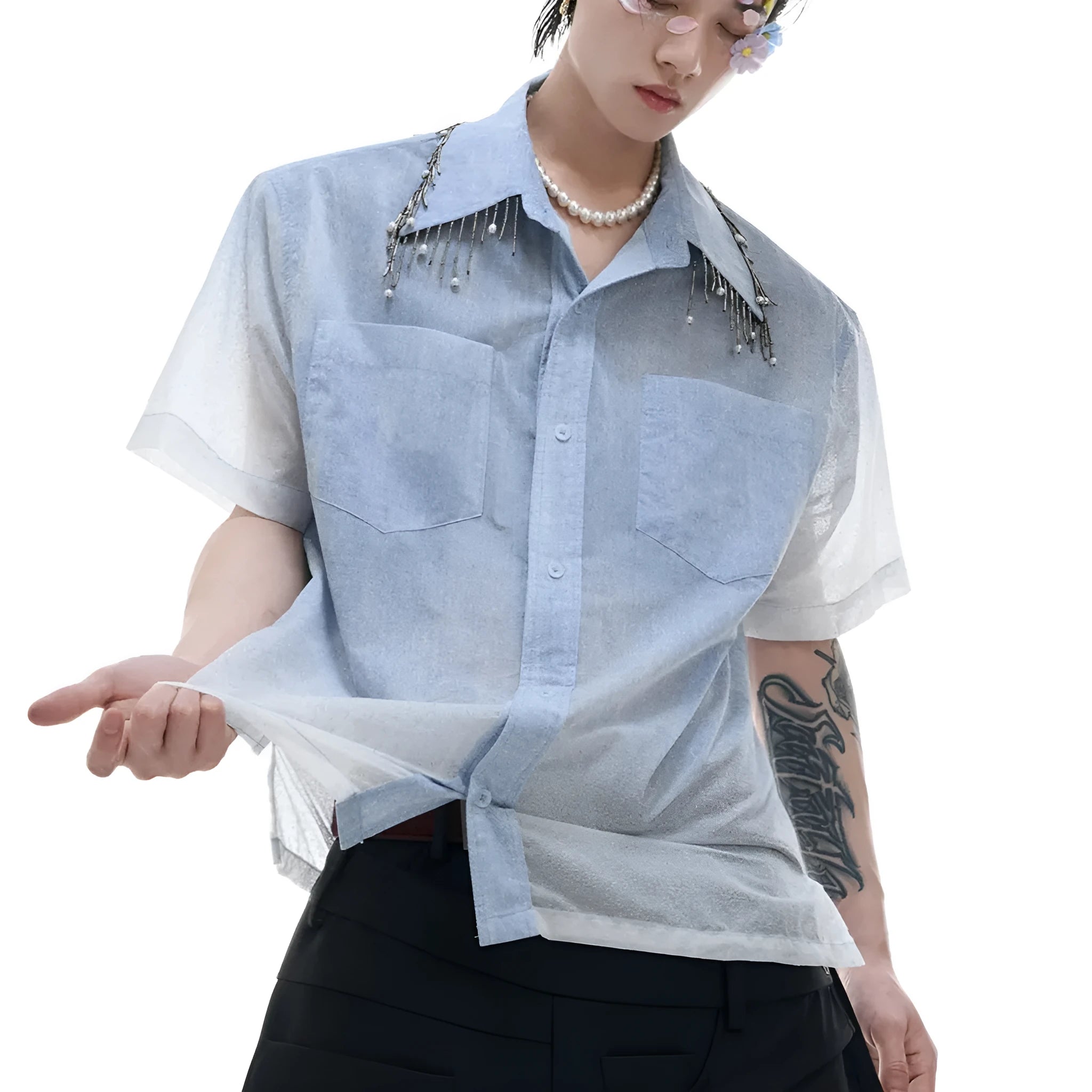 Man wearing a loose fit blue and white gradient short sleeve shirt with quilted details