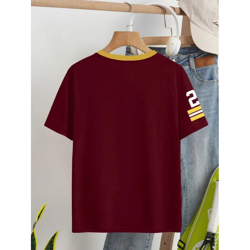 Man's loose fit red cotton t-shirt with a digital print of contrasting green letters on the front.