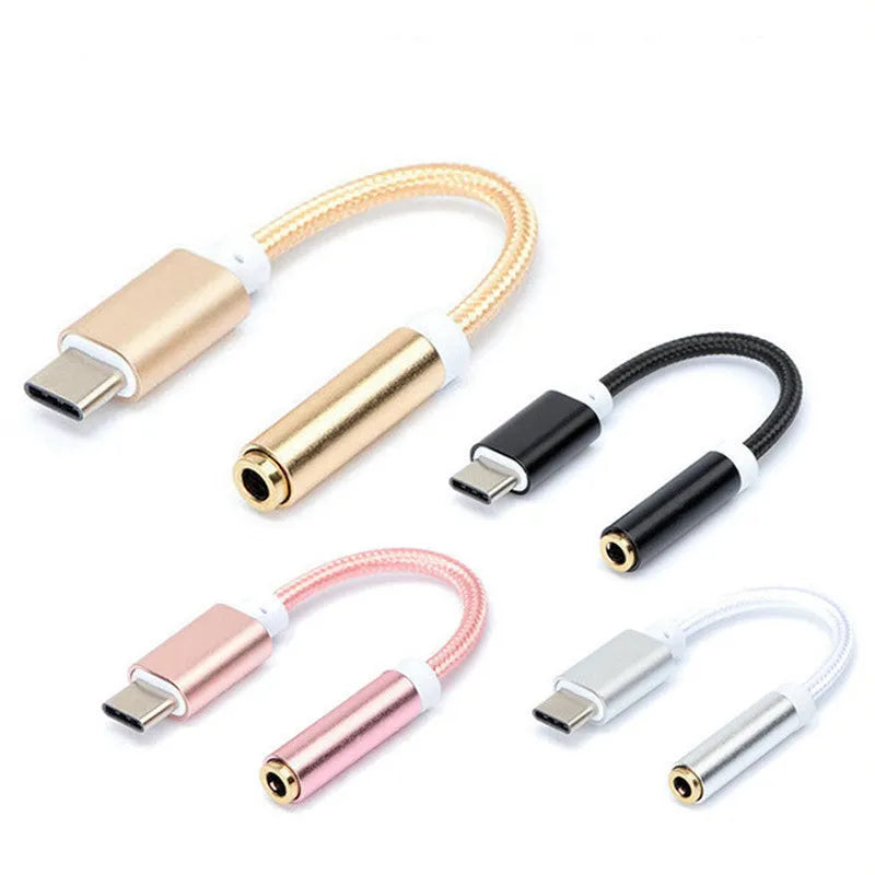 Nylon braided Type-C to 3.5mm female audio adapter cable in black, shown next to a mobile phone.