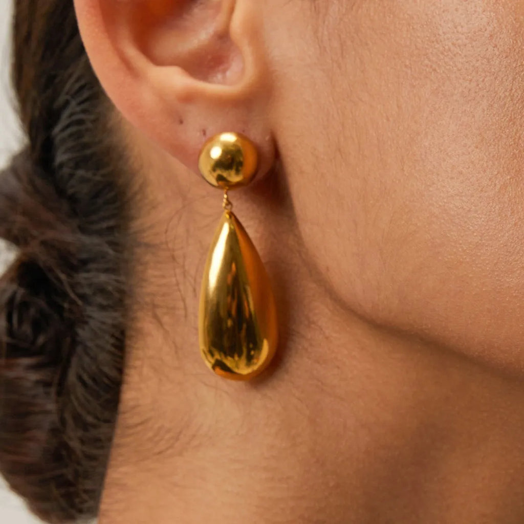 Gold geometric water drop earrings with hemisphere pendant design on stainless steel