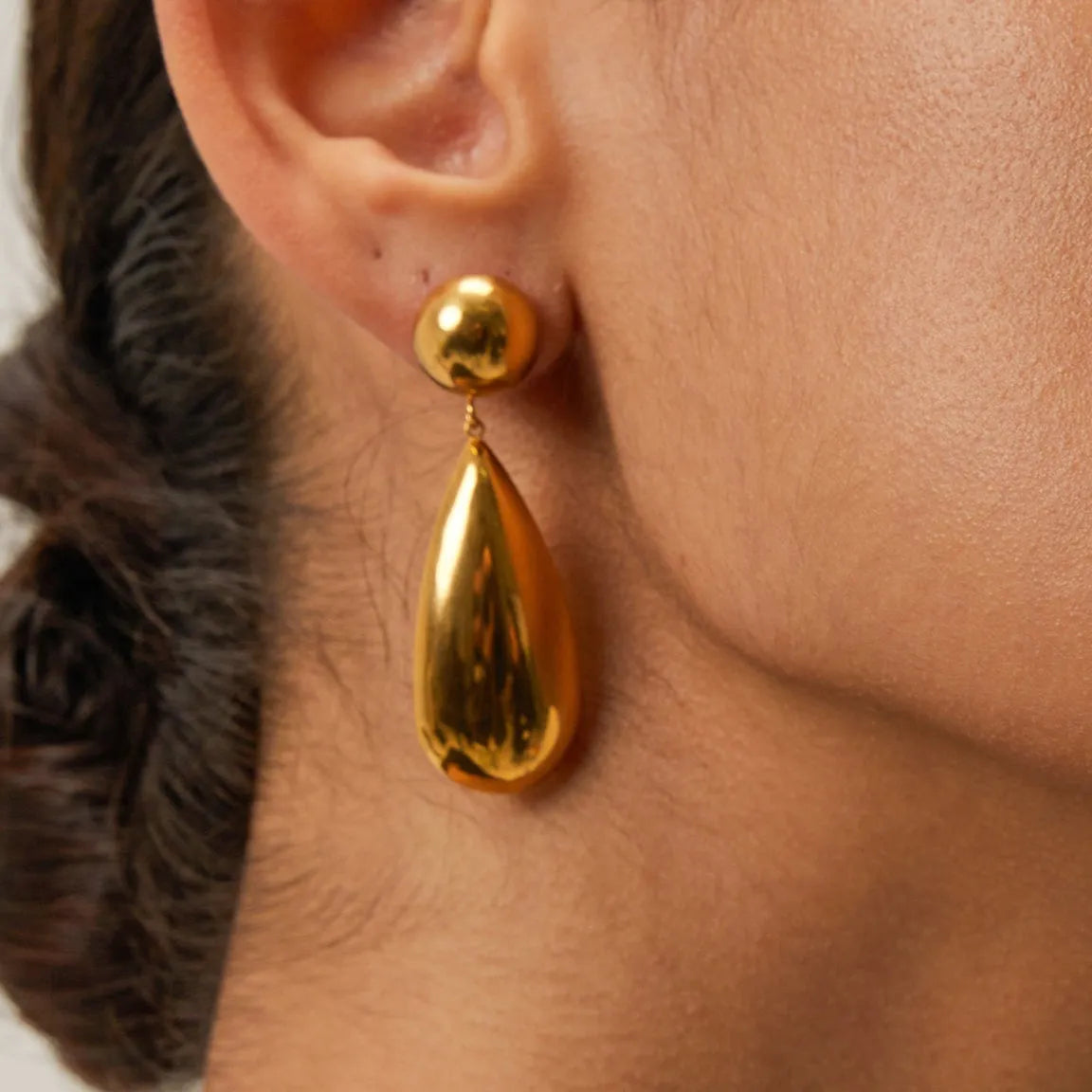 Gold geometric water drop earrings with hemisphere pendant design on stainless steel