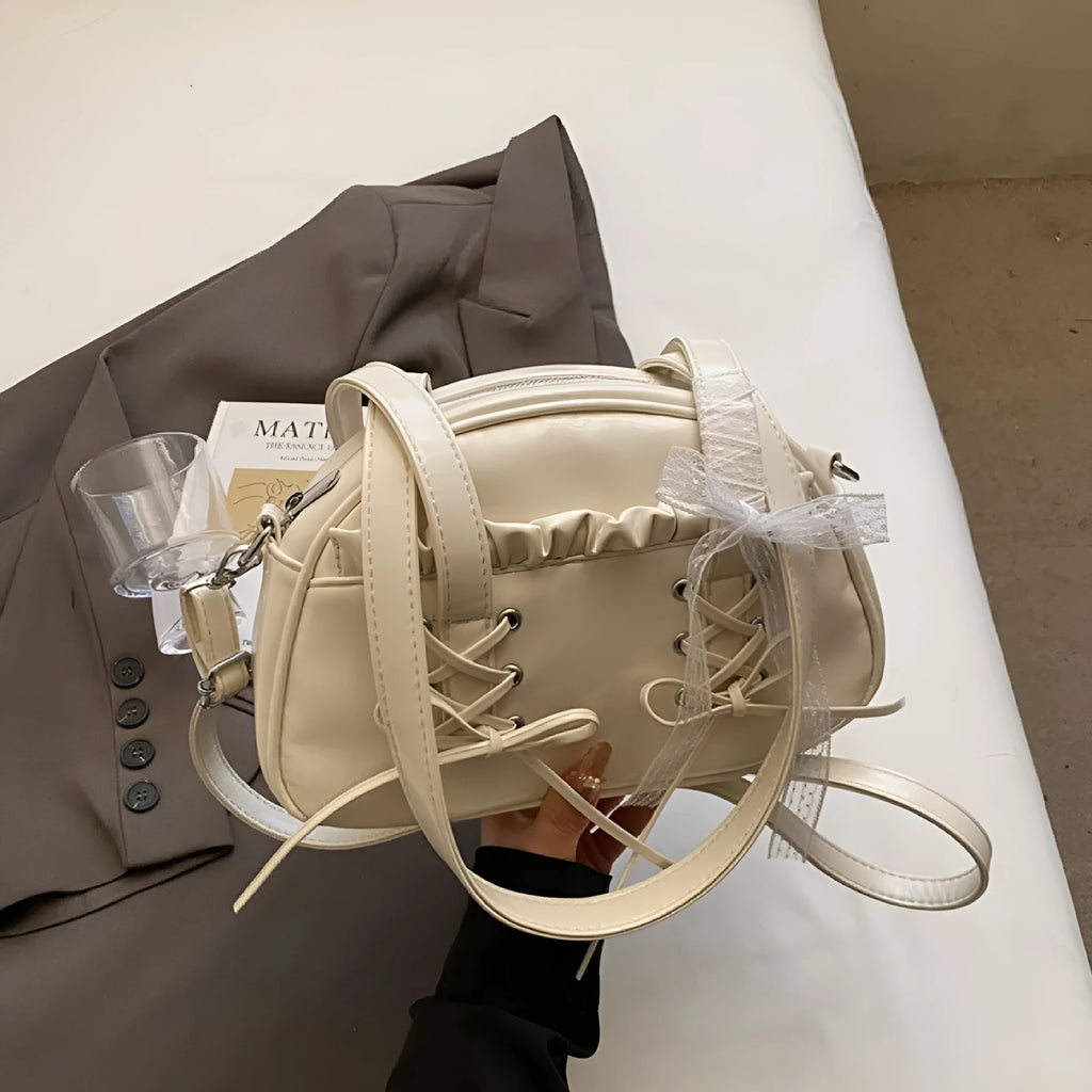 Women's fashion handbag with bandage bow design and mobile phone compartment in selected colour