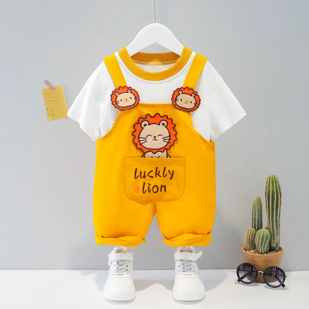Baby wearing yellow cotton short-sleeved overalls with a cartoon print and openable straps.