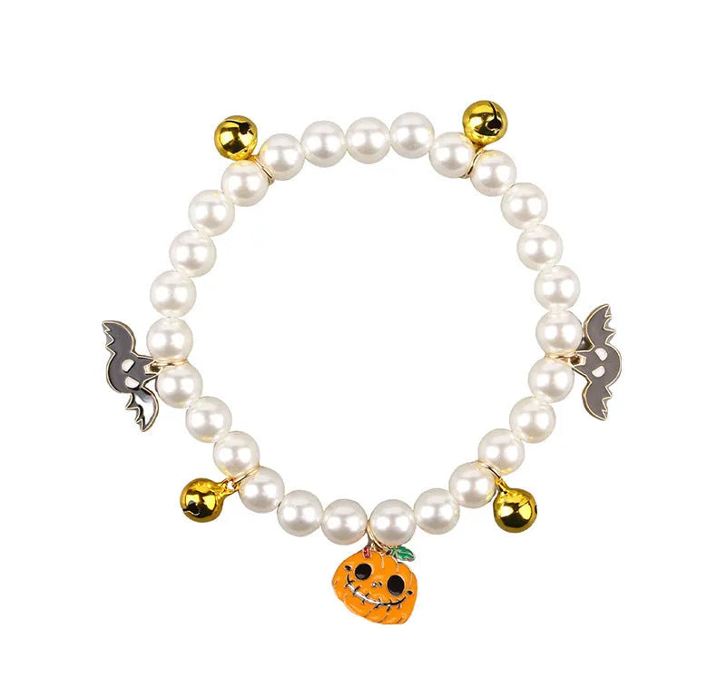 Halloween-themed cat collar with simulated pearl necklace decoration showing pumpkin designs
