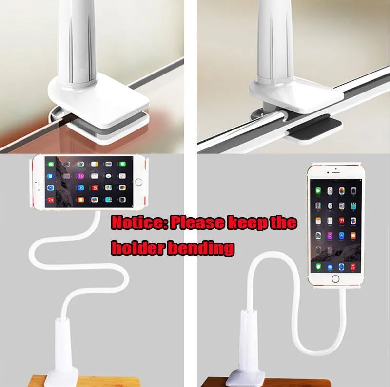 Black bedside oversize flat panel phone holder with a long arm mounted on a table.