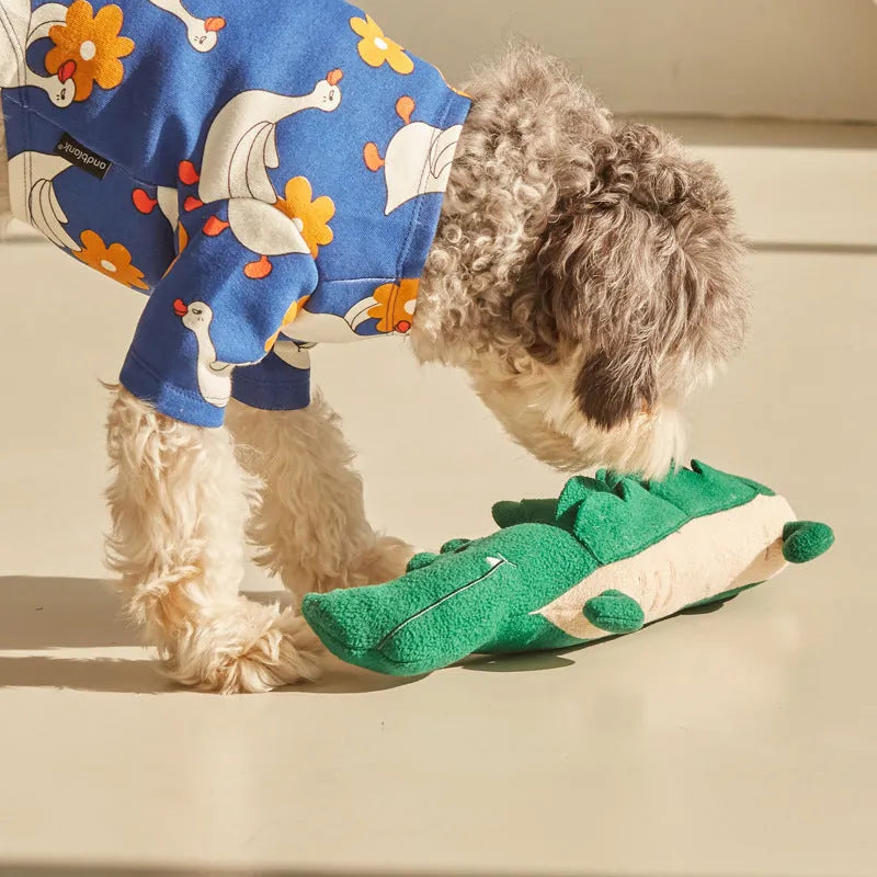 Green plush toy dog stuffed animal on a white background.