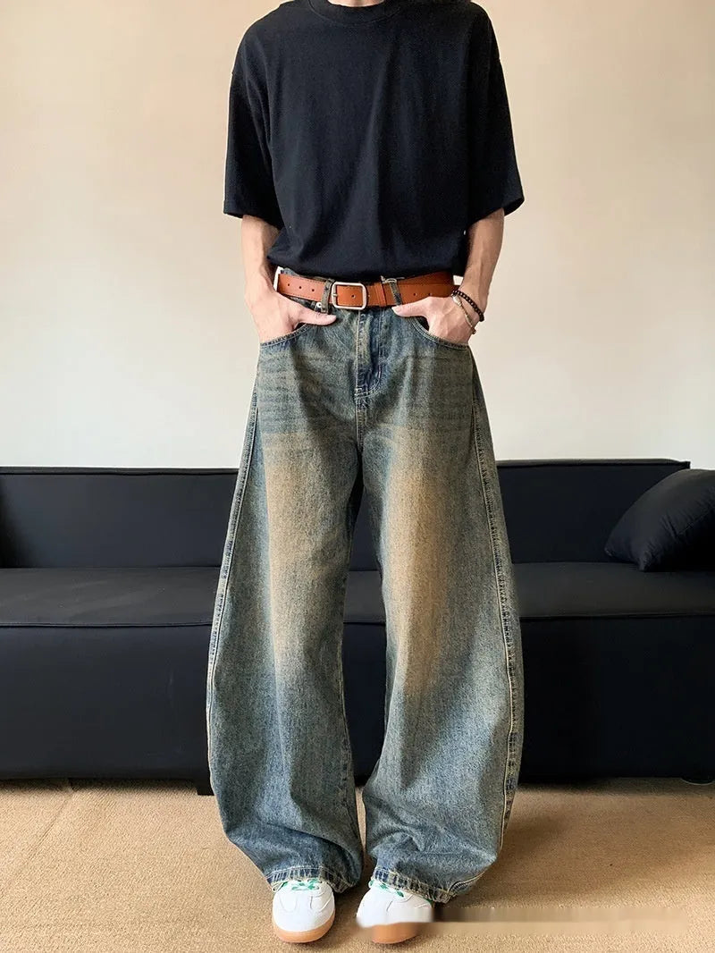 Men's retro blue distressed jeans with machete wash pattern and wide-leg design