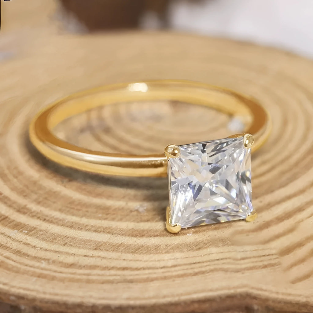 A geometric 925 silver women's ring with a round zirconium stone, shown in gold, rose gold, and silver finishes.