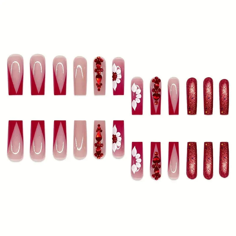 Long European square fake nails with red diamond and flower pattern design, shown with glue and file