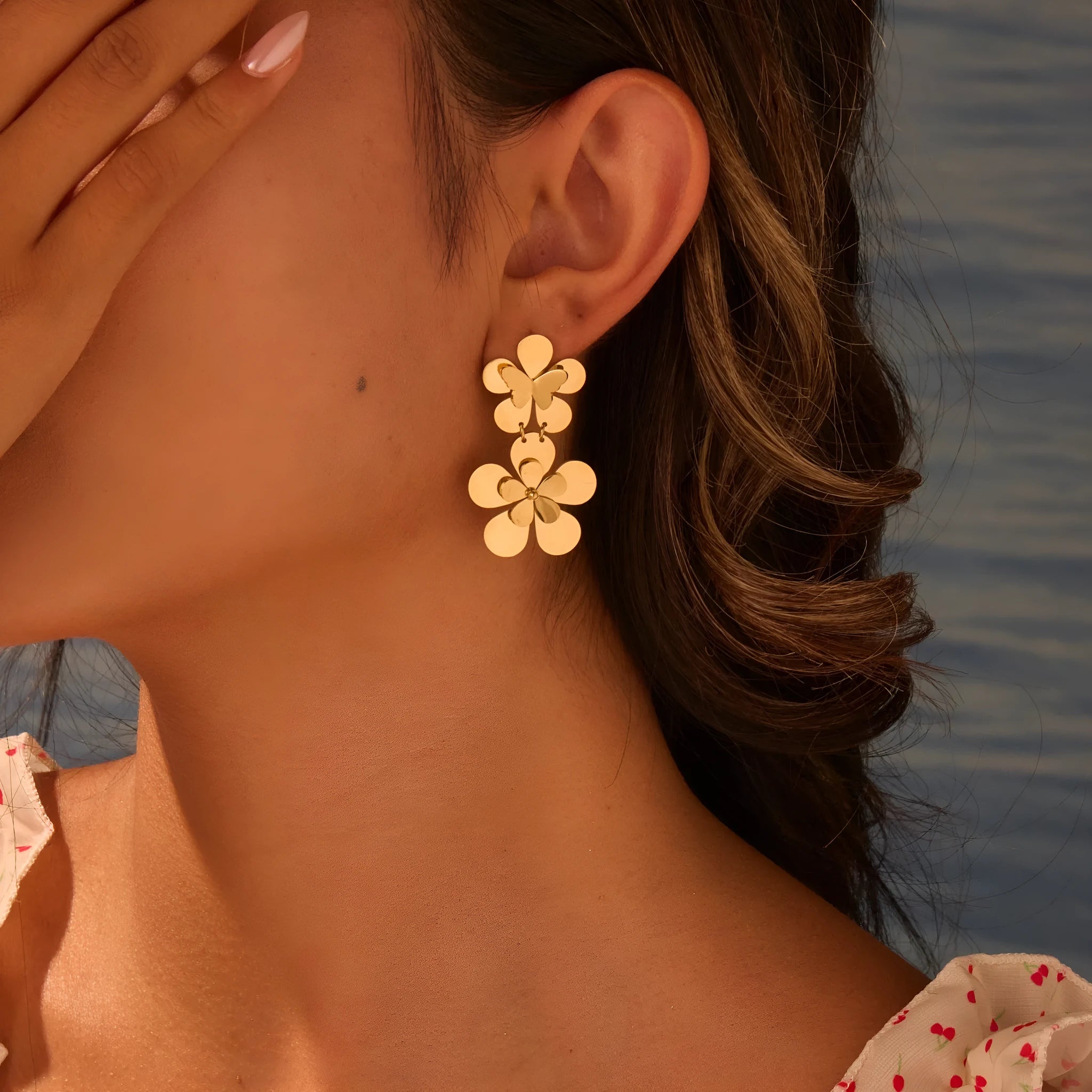 Gold plated stainless steel earrings featuring flower and butterfly geometric design for women