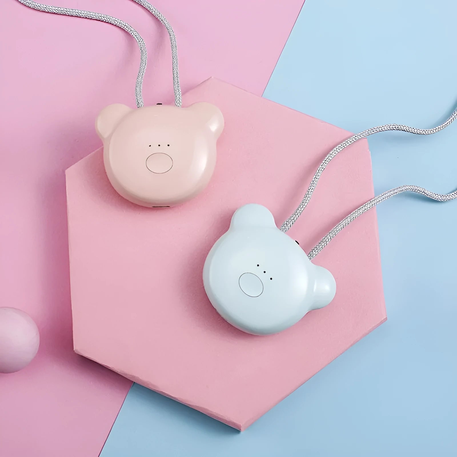 Mini USB portable air purifier necklace in blue, shown next to its charging cable.