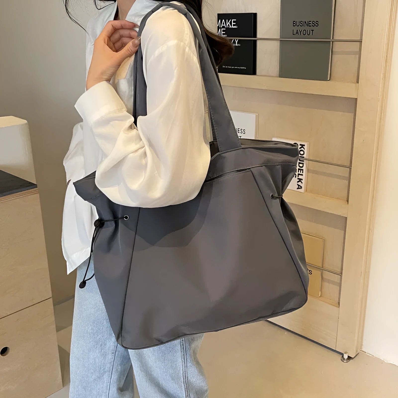 Oxford cloth folding tote bag in five colour options: black, brown, dark grey, light grey and purple.