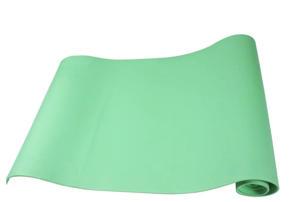 EVA fitness yoga mat in blue, showing its texture and thickness, rolled up with its OPP storage bag.