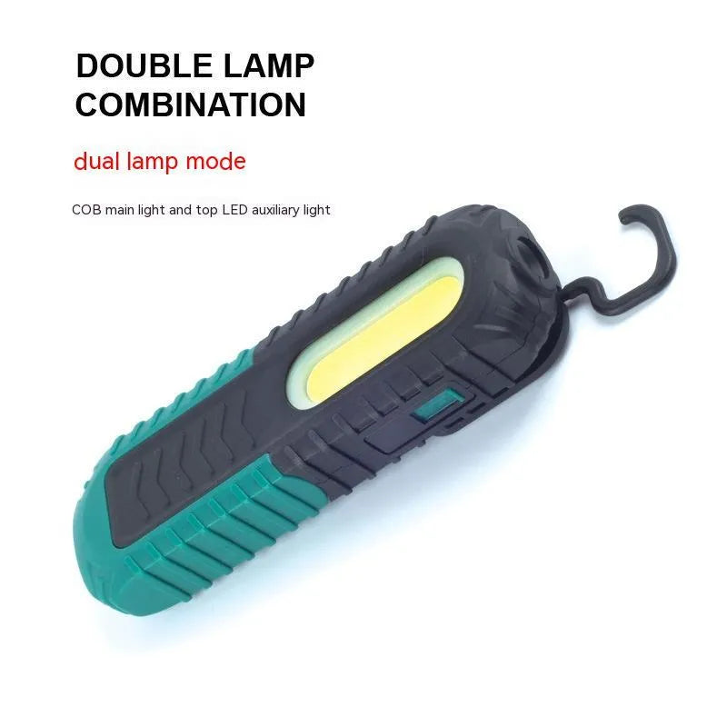 Black and green auto repair work light with USB charging cable and PET-coated ABS construction
