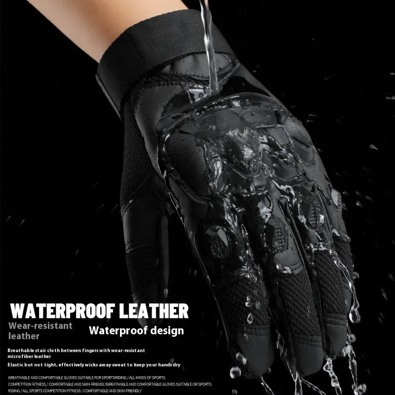 Men's black tactical gloves with touch screen fingertips on a hand holding a smartphone