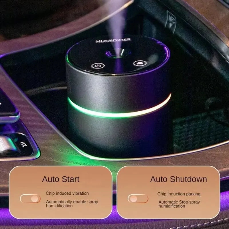 Black aluminium portable car air humidifier and essential oil diffuser unit with USB cable.