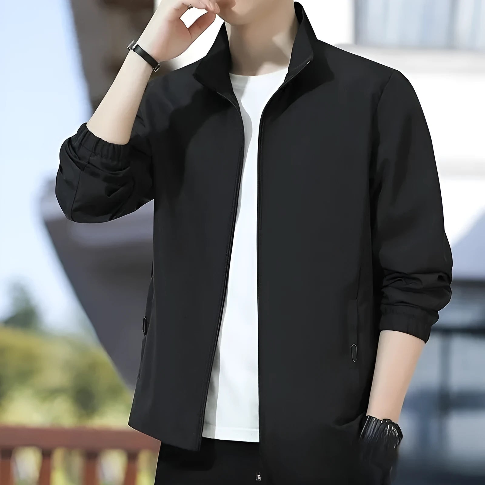 Man wearing black loose-fit Korean style autumn jacket with zip pockets