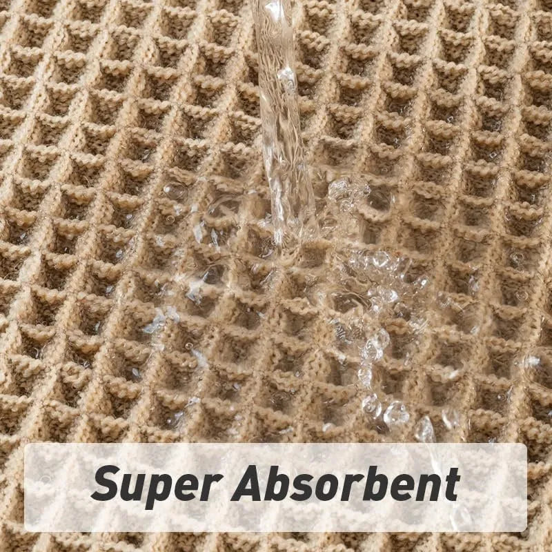 Square checkered polyester bathroom carpet on a tiled floor in a light grey colour.