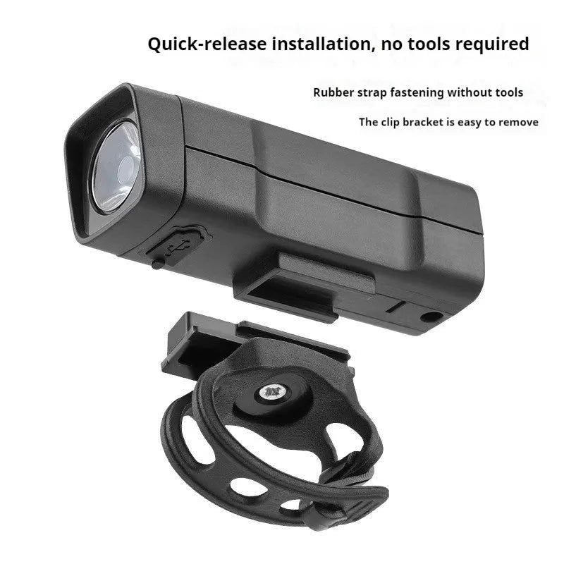 USB rechargeable bicycle headlight with quick-release strap on handlebars.