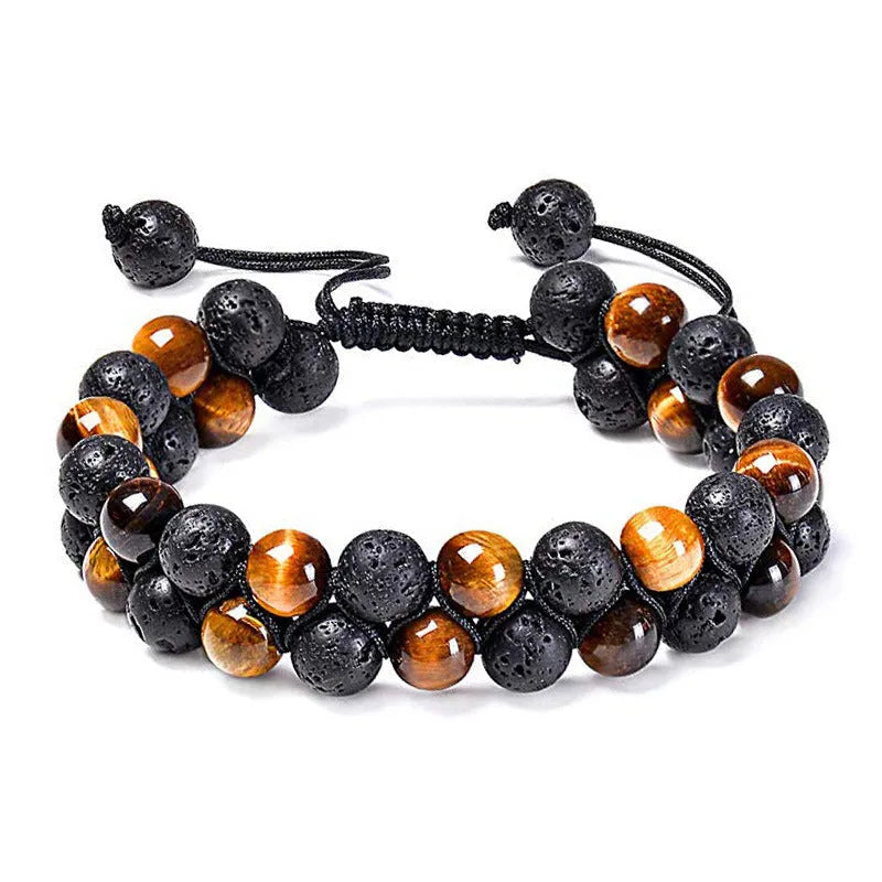 Matte black agate tiger eye bead couple bracelets with geometric design on a neutral background.