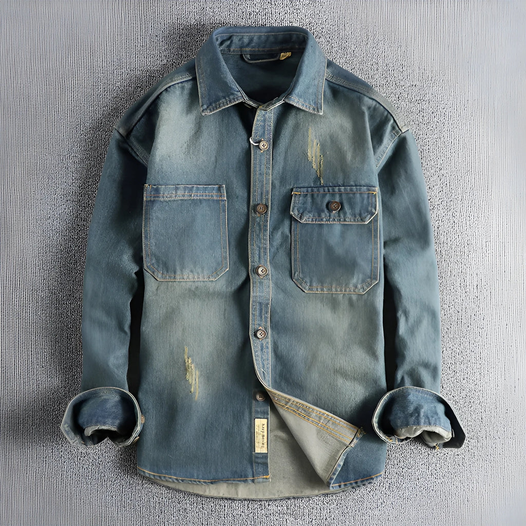 Man wearing a light blue loose-fit vintage denim shirt with long sleeves in a cardigan style.