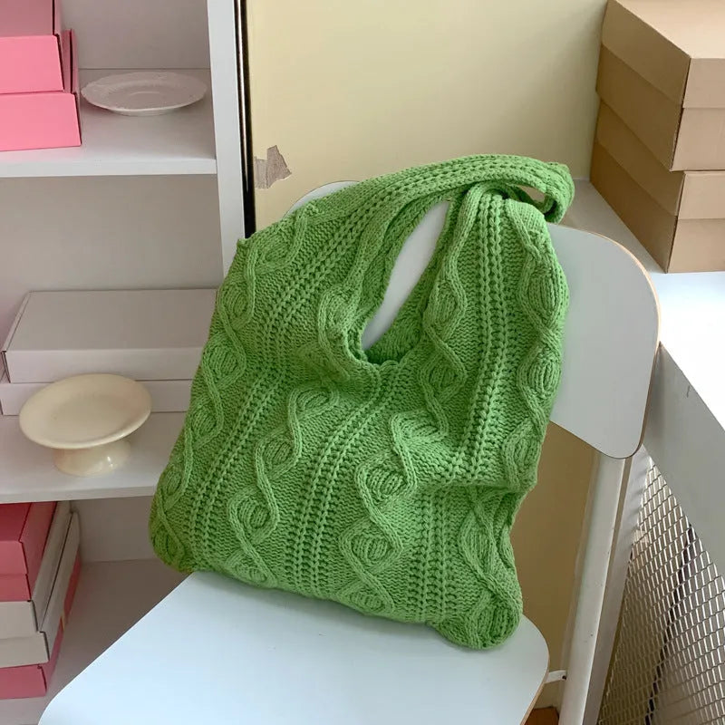Women's retro-style knitted crochet tote bag with double shoulder straps in a solid colour.