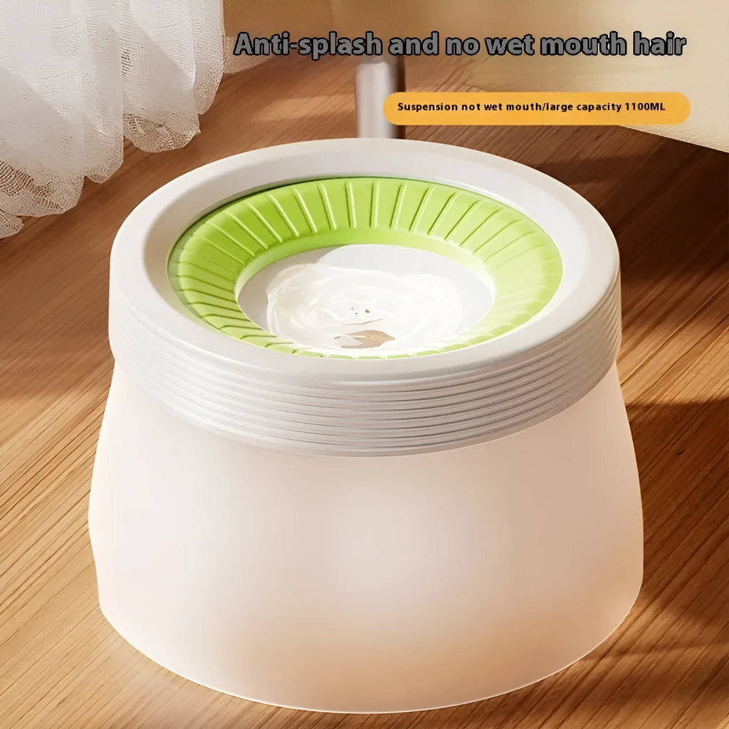 Green non-wet mouth suspension pet water bowl for dogs and cats on a white plate