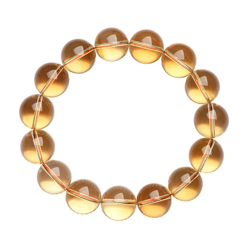 Natural citrine scattered beads ball bracelet showing polished stones in a 7A or 6A grade colour on a wrist.