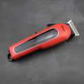 Professional digital electric hair clipper in black with brushless motor, waterproof body, and four limiting combs for pet and human grooming