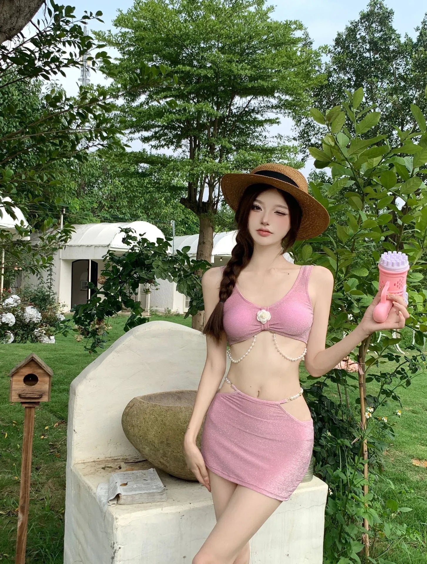 Bear Vacation pink and black three-piece polyester bikini set for women.