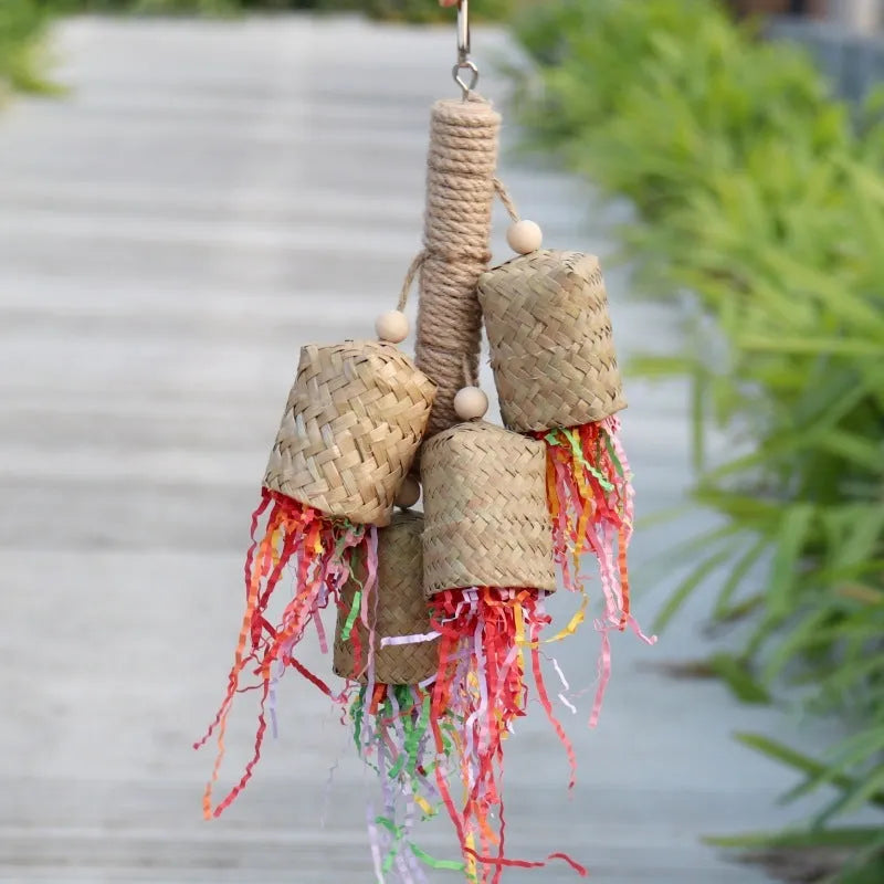 Wood and sisal parrot toy with colourful shredded paper measuring 15cm by 35cm