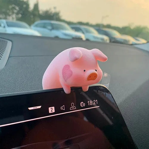 Colourful 3D resin cartoon pig figurine car decoration on a car dashboard