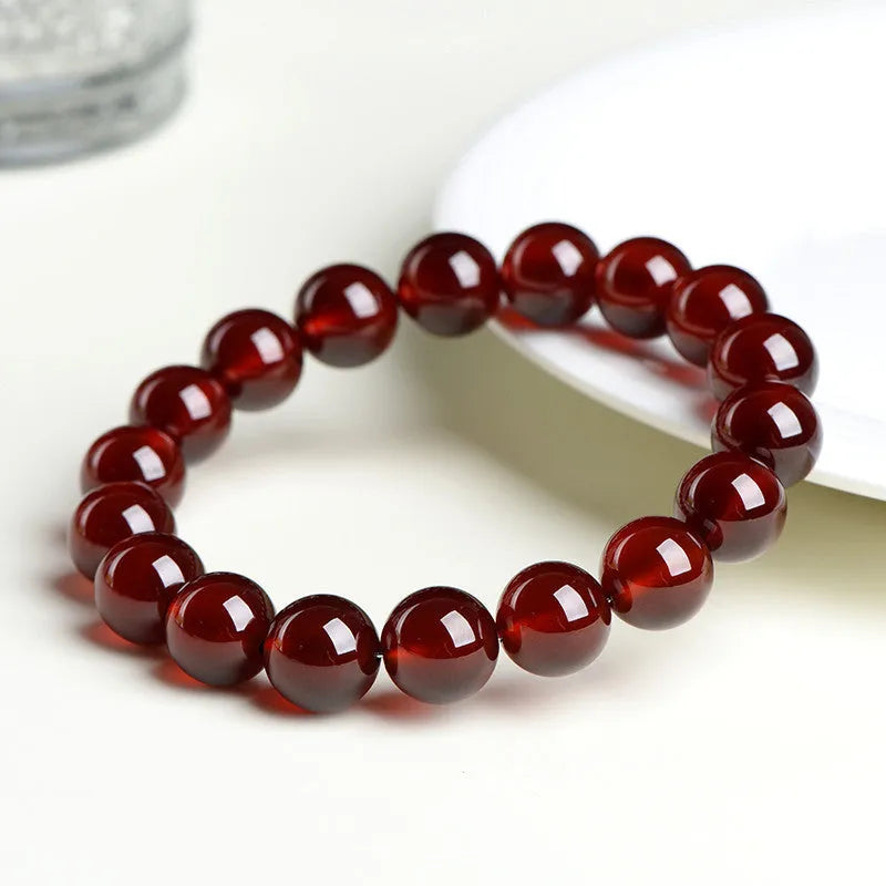 Natural Orange Red Garnet ball crystal bracelet with retro styling and Ruyi element in unisex design