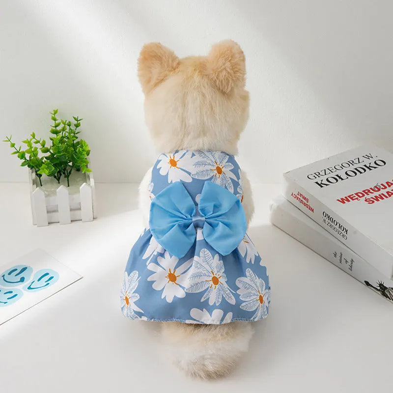 Ultra-thin floral butterfly knot pet dress for dog or cat with coloured bow, shown in blue.
