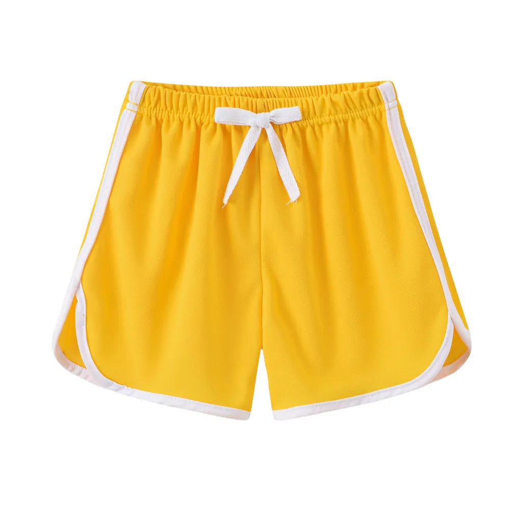 Children's polyester beach shorts in various colors and patterns including pineapple and kitten designs for sizes 100 to 140